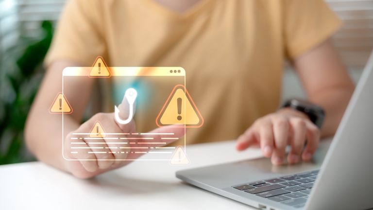 Web,Phishing,And,Cyber,Attack,Warning,Concept,With,Man,Using